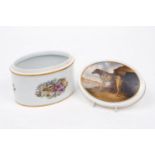 A Rosenthal porcelain oval box and cover, 20th century, painted to the cover with a lurcher signed