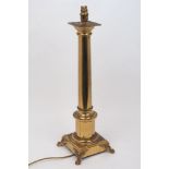 A brass column table lamp, late 20th century, the square base with paw feet, 53cm high excluding