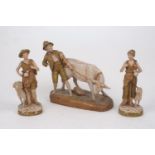 A Royal Dux figure group of a boy with a calf, in typical green and beige colour palette, 27cm x