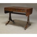 A George IV style mahogany and crossbanded sofa table, late 19th, early 20th Century, with two