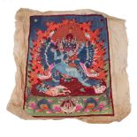 A Tibetan embroidered silk panel, early 20th century, depicting Yamantaka striding in alidhasana
