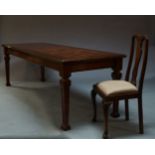 A mahogany and parquetry inlaid dining table, 20th Century, the rectangular top on square tapering