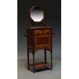 An Edwardian mahogany washstand, the top surmount with adjustable octagonal mirror, above two