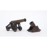 Two bronze miniature model cannon, early 20th century, one with long tapered barrel on cast iron