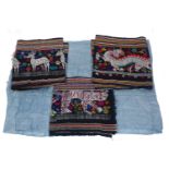 A collection of Eastern textiles, including four blue silk textiles and various embroidered