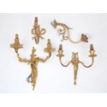 Four similar gilt metal wall lights, 20th century, two with two branches, one case with acanthus