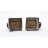 A pair of A. Lincoln cufflinks, the white metal links with yellow metal sliding panel signed 'A.