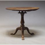 A Georgian style mahogany occasional tilt top table, 19th Century, the circular top above birdcage