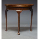 A Queen Anne style mahogany demi-lune card table, late 20th Century, the fold over top enclosing