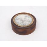A George III tortoise shell snuff box, of circular form, the cover designed with glazed aperture