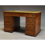 A mahogany pedestal desk, late 19th, early 20th Century, the rectangular top with green
