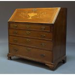 A George III mahogany and inlaid bureau, the fall with marquetry inlaid urn and foliate