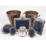 Two silver plated champagne buckets, a caviar dish, and five silver photograph frames, 20th century,