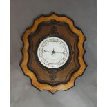 A walnut wall barometer, 20th century, designed with white enamel dial, Arabic numerals, to a