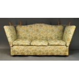 A Knole three seat sofa, second half 20th Century, the serpentine backrest with tapered finials