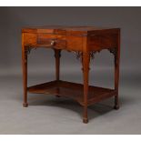 A George III mahogany dressing table, the hinged lid with twin flaps, enclosing poudreuse mirror and