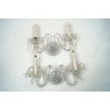 A selection of Waterford crystal wall sconces, 20th century, each with twin branches, bowls form