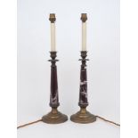 A pair of veined rouge marble and brass table lamps, early 20th century, 32cm high to