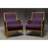 A pair of Louis XVI style bergère armchairs, late 20th Century, upholstered in purple fabric, with
