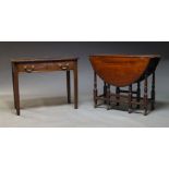 A George I mahogany gate leg table, the oval top on turned legs on Flemish feet, 73cm high, 110cm