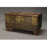 A Zanzibar chest with brass nail decoration, early 20th Century, the hinged lid enclosing storage