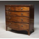 A Regency mahogany bow front chest, with two short over three long graduated drawers, raised on