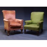 A Victorian armchair, upholstered in green fabric, on turned front legs with ceramic casters,