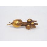 An Etruscan style gold earring, with filigree details, sheppard's hook fitting, 6.5cm longPlease
