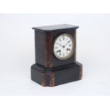 A Victorian black slate and rouge marble mantle clock, of architectural plinth form with cornice and