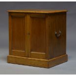 A Victorian oak specimen cabinet, enclosing 60 fitted drawers, with brass carrying handles to each