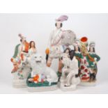 A collection of Staffordshire figural groups and figures, 19th century and later, to include: a