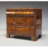 A French flame mahogany chest of drawers, 19th Century, the quarter veneer top above above three