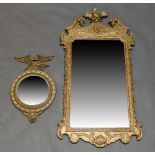 A George III style gilt gesso wall mirror late 19th, early 20th Century, the top with broken