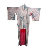 A Japanese Kimono, 20th century, in a cream ground, decorated all-over with flora in a pink and