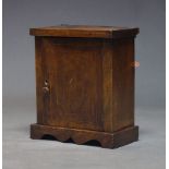 A Continental walnut and inlaid spice cupboard, 18th Century, with single cupboard door enclosing