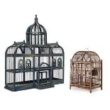 A painted bird cage, 20th century, of architectural design with a central cupola and flanking ogee
