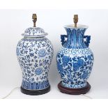 A pair of Chinese porcelain blue and white table lamps, 20th century, one with two handles to