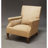 A Victorian armchair, in the manner of Howard & Sons, upholstered in tweed fabric, raised on front