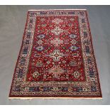 A modern West Persian rug, with five central medallions in red floral decorated field, 194cm x