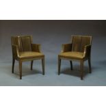 A pair of stained wood armchairs by Phillip Hurel, late 20th Century, each with slatted backs and