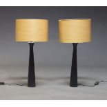 A pair of contemporary ebonised lamps, of recent manufacture, with beech veneered lampshades, on