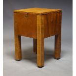 An Art Deco walnut drinks cabinet, the square top with hinged lids enclosing fitted drinks