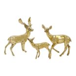 A group of three brass deer, British, circa. 1960, each of plain polished form, tallest 18cm high (