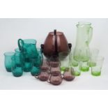 A group of modern glass hosting sets, comprising: a purple glass punch bowl, of globular form,