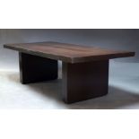 A modern stained wood dining table, of recent manufacture, the rectangular top on conforming