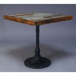 A painted wood and cast iron side table, of recent manufacture, the square top consisting of painted