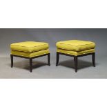 A pair of modern foot stools, of recent manufacture, with square yellow fabric upholstered seats
