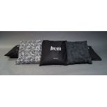 Hem, a set of seven contemporary cushions, of recent manufacture, comprising four black and three