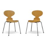After Arne Jacobsen, a pair of beech 'Ant' chairs for Fritz Hansen c.1997, applied manufacturer's
