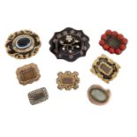 A group of eight 19th century gilt-mounted mourning brooches, comprising: three enamel examples, one